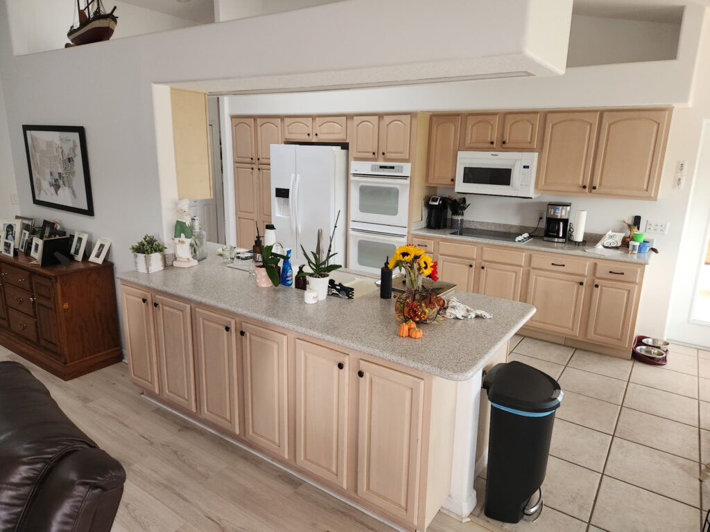 Freshly painted kitchen cabinets in a modern Melbourne FL home by Fresh Finish Custom Coatings