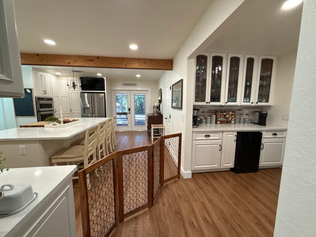White kitchen cabinets with wood countertops and modern farmhouse style in Melbourne Florida